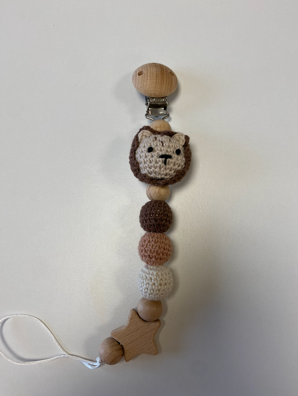 Tamborēts knupīša turētājs
