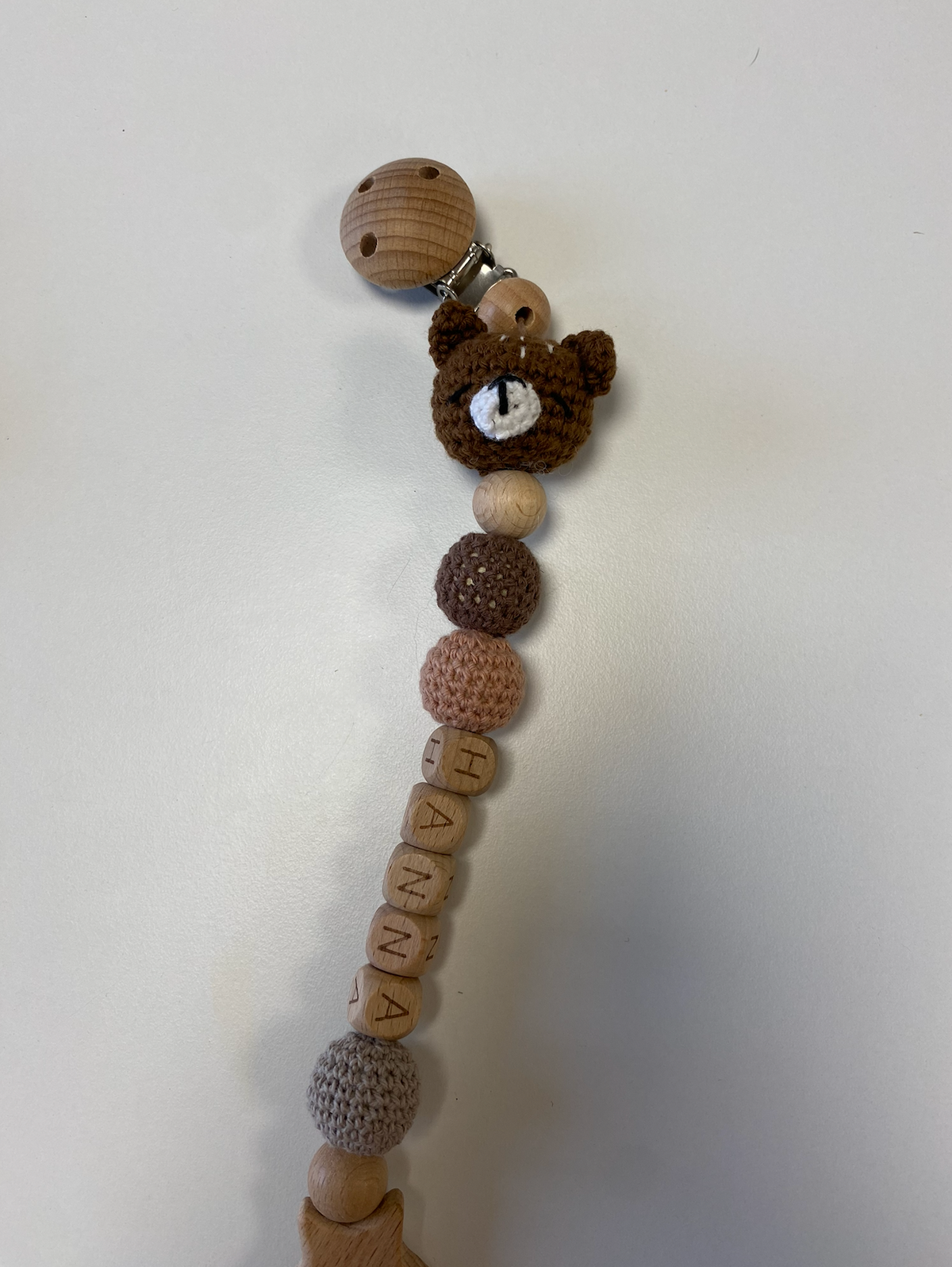 Tamborēts knupīša turētājs