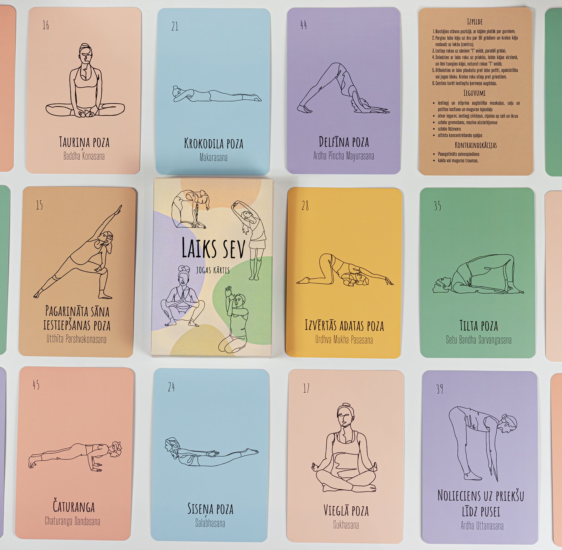 A grid of illustrated yoga cards in pastel colors, showing different poses with black line drawings and some cards containing text instructions in Latvian.